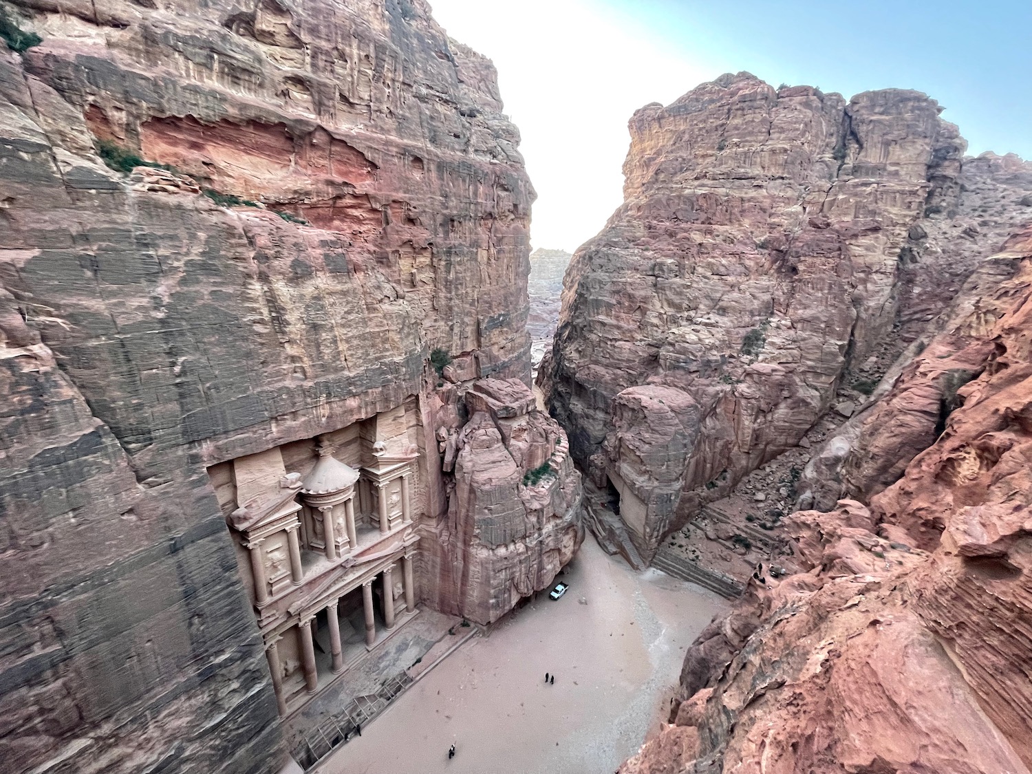 a rock formations with a building in the side