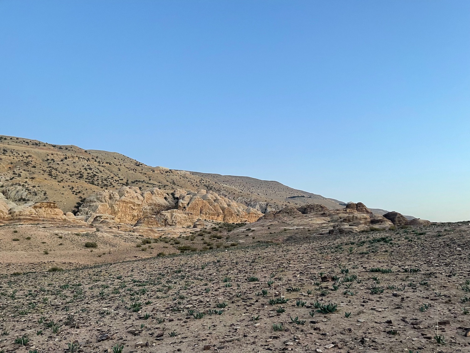 a rocky landscape with a blue sky