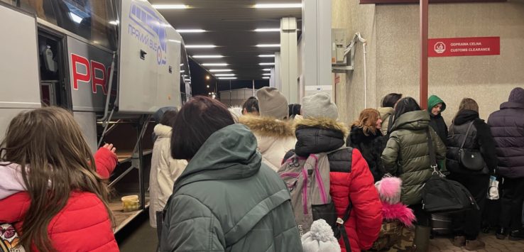 a group of people standing in a line