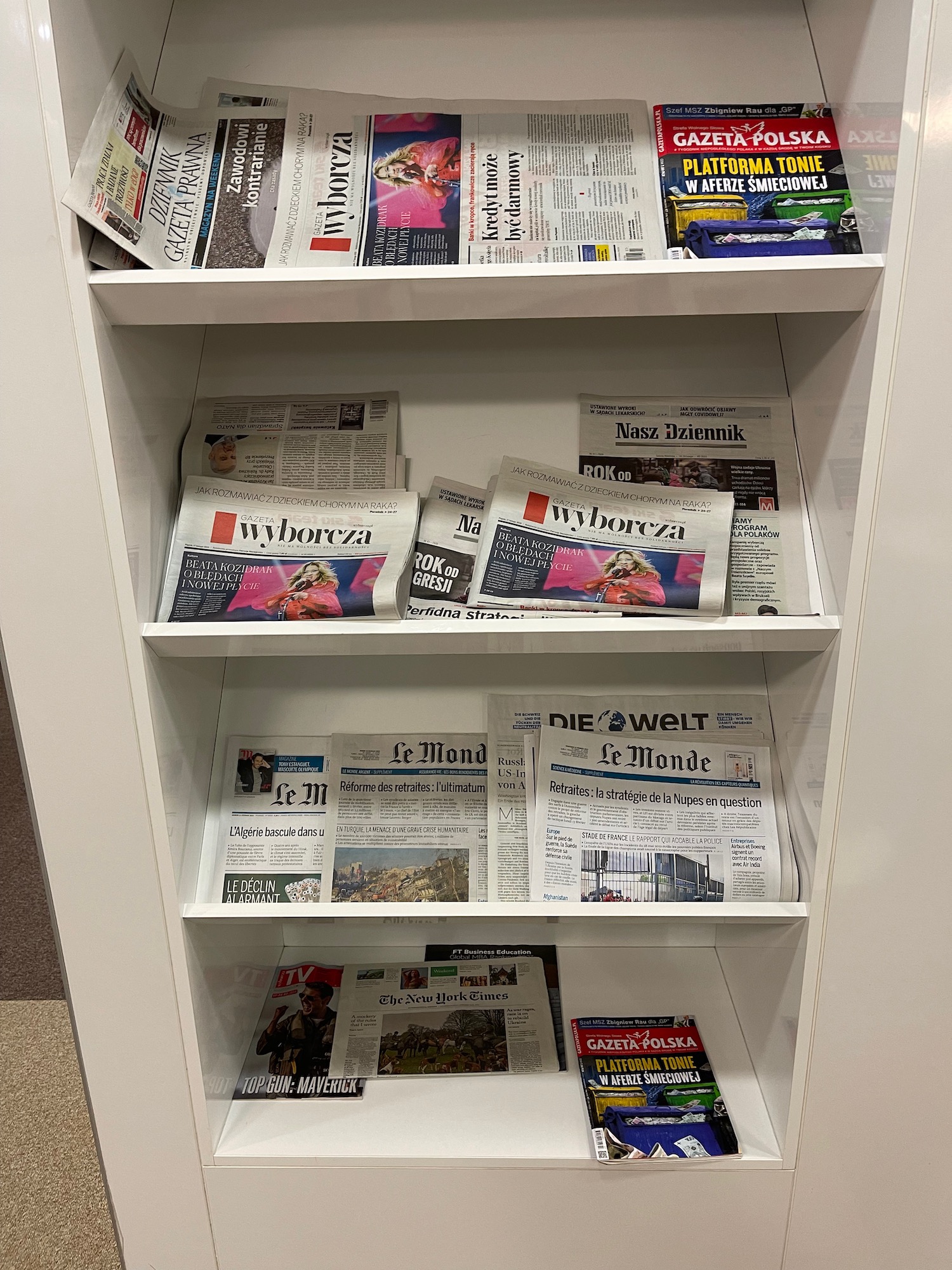 a shelf with newspapers on it