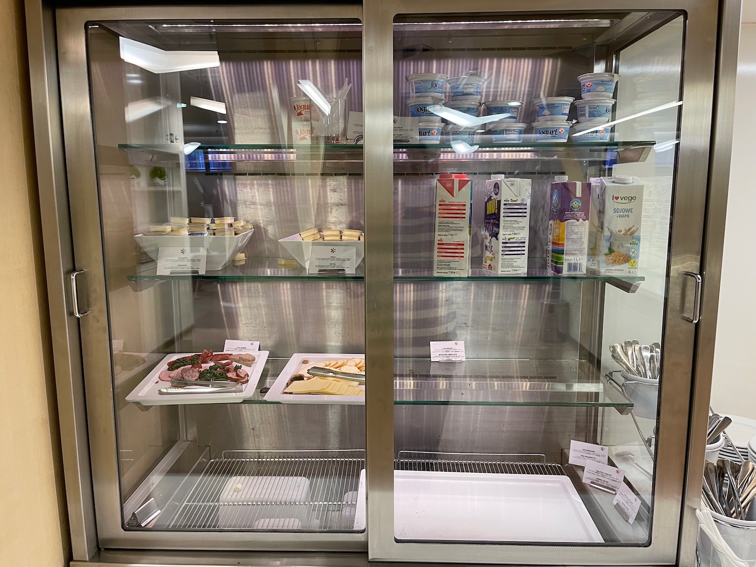 a glass cabinet with food on it