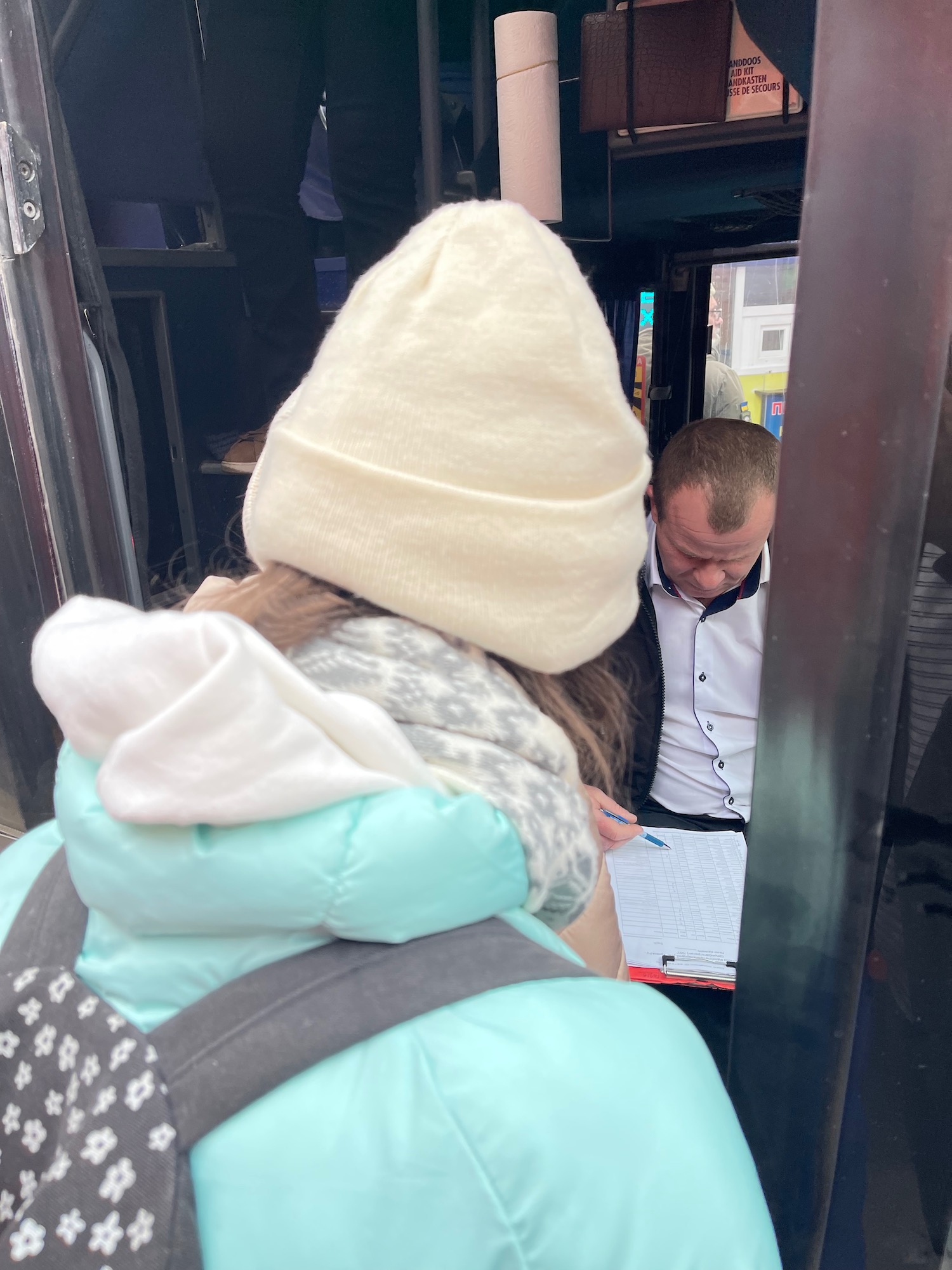 a woman looking at a man in a bus