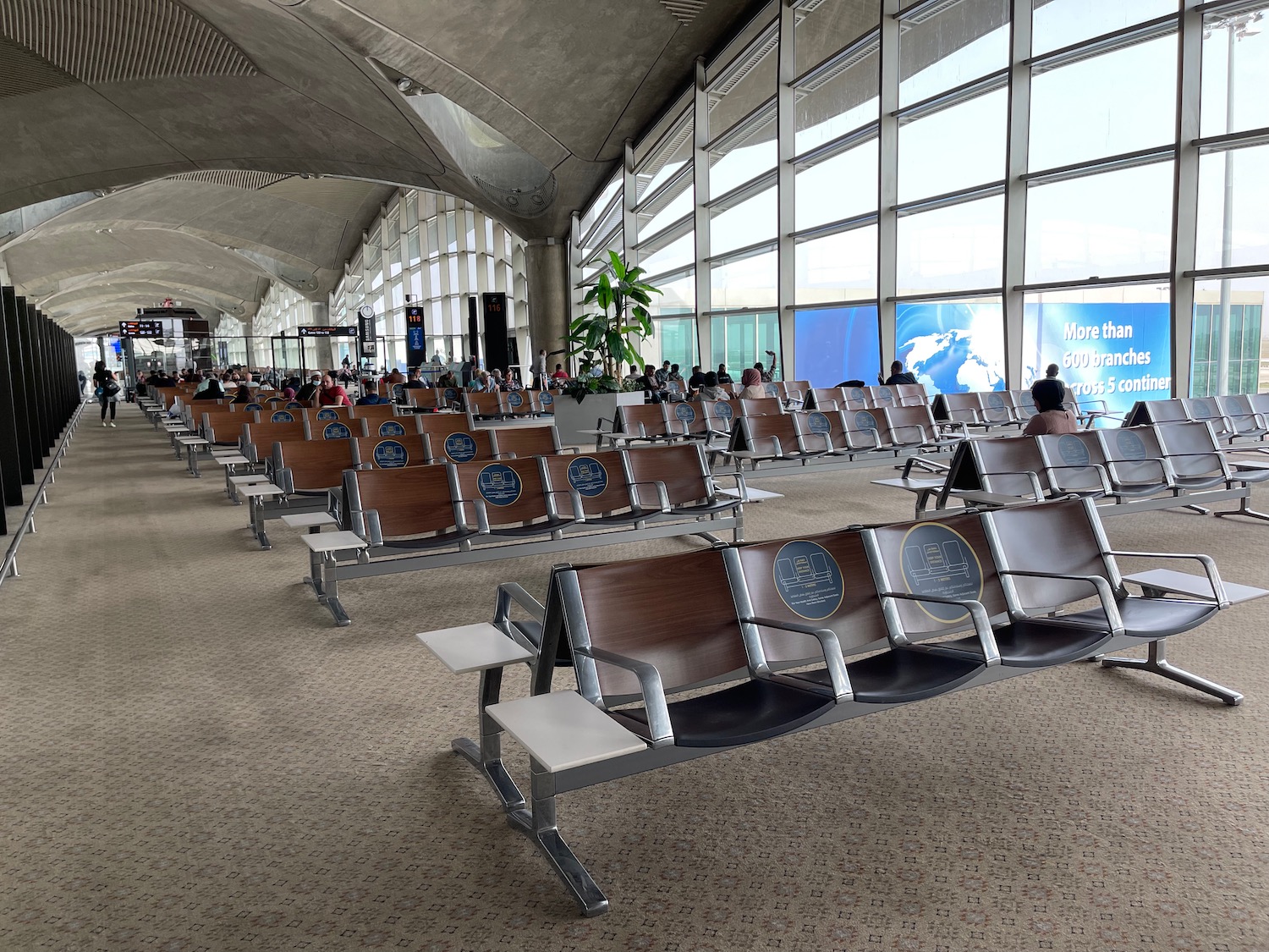 rows of chairs in an airport terminal