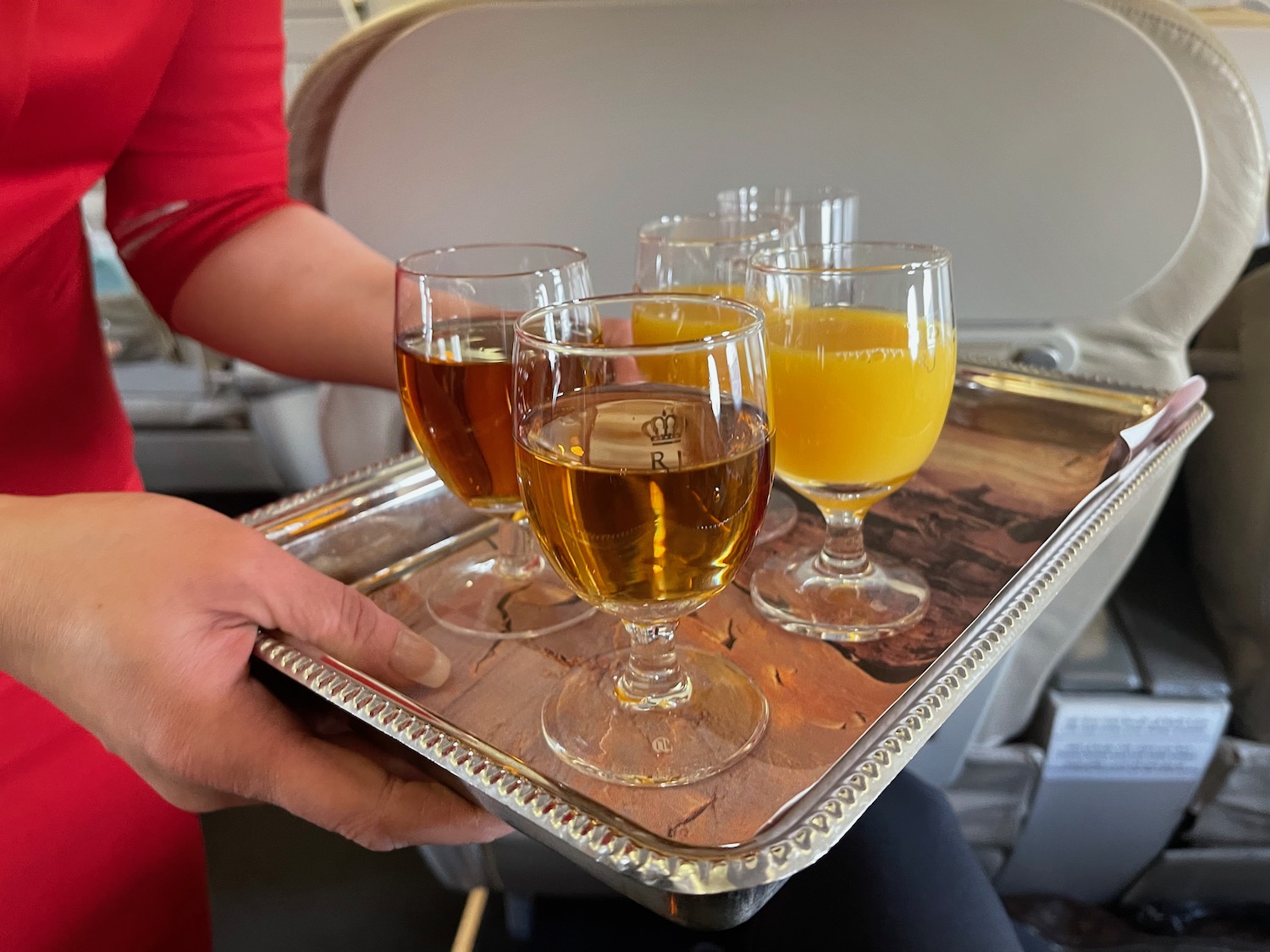 a tray of drinks on a plane