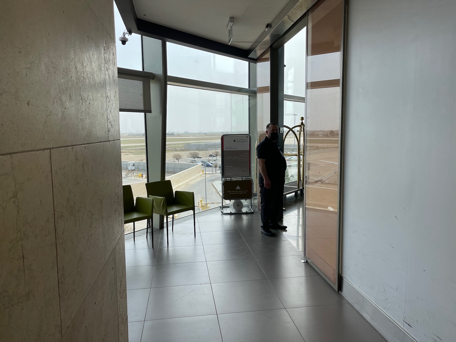 a man standing in a room with a window