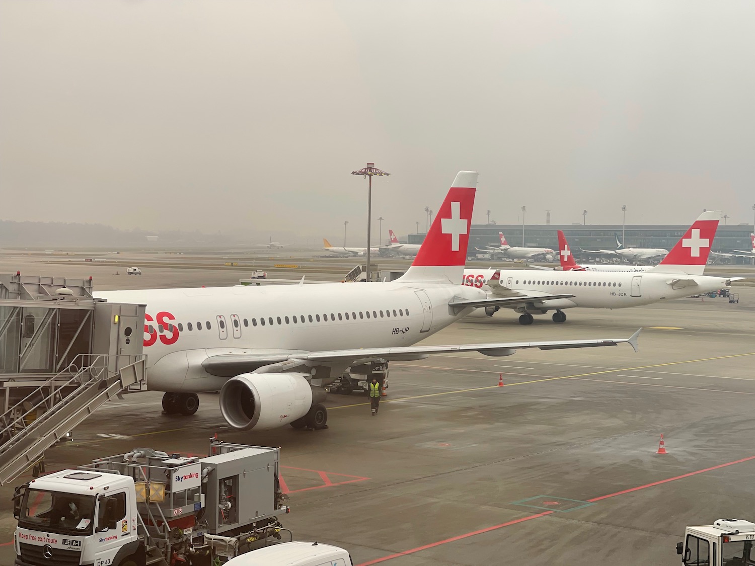 a group of airplanes on a runway