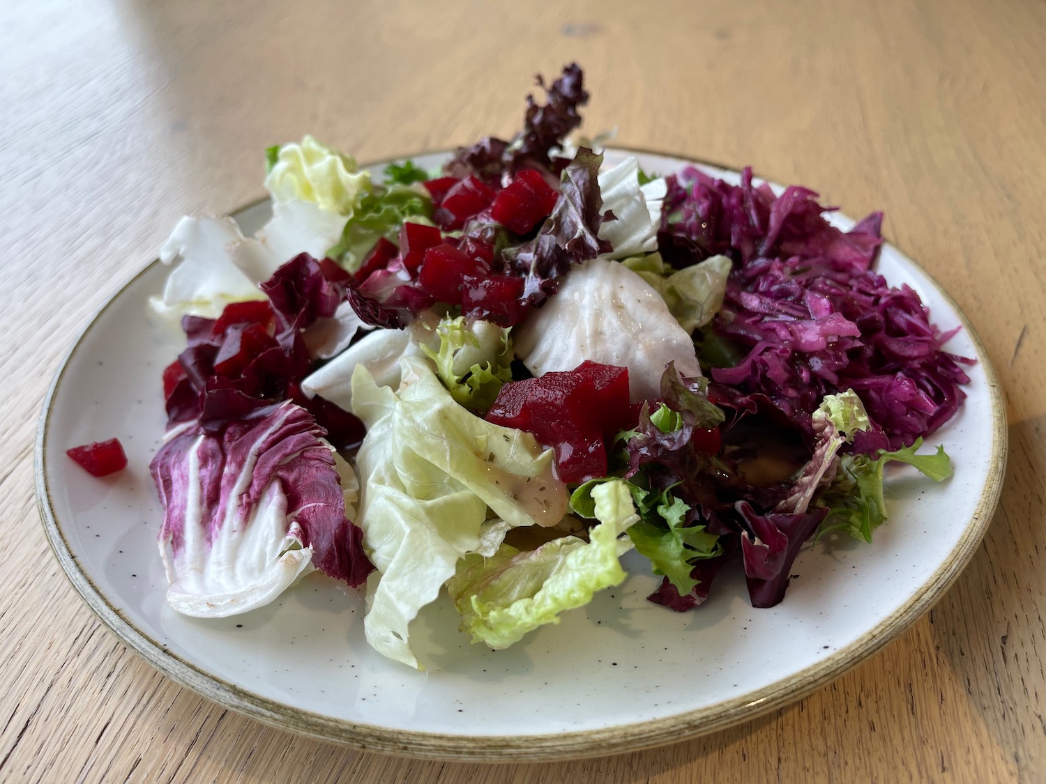 a plate of salad on a table