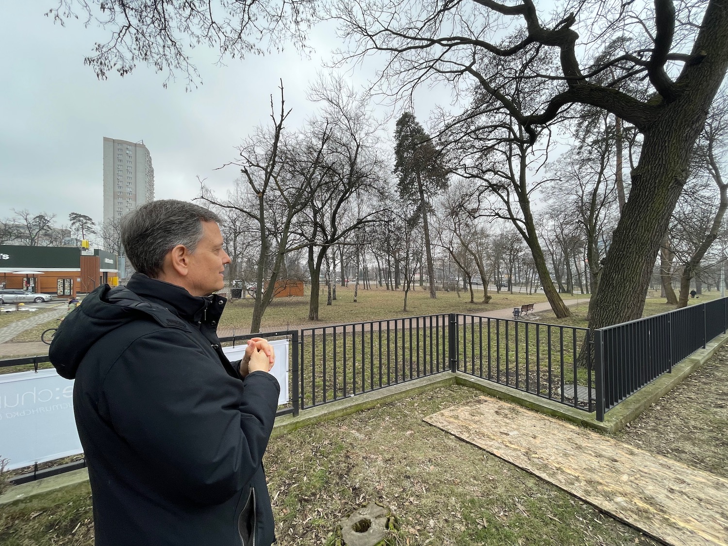 a man standing outside in a park