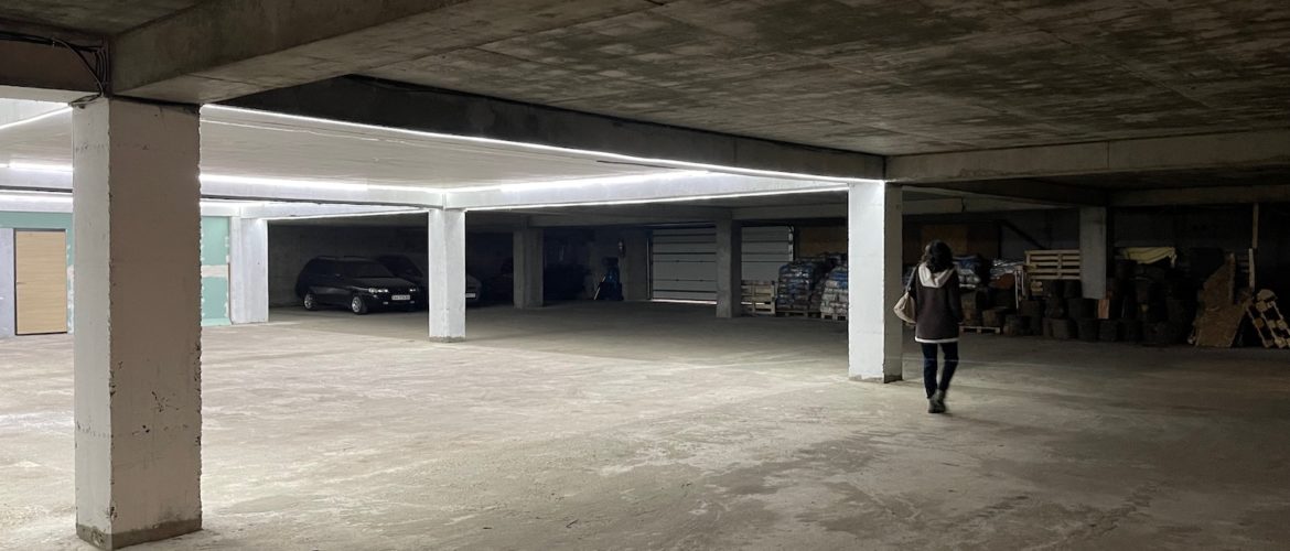 a person walking in a parking garage