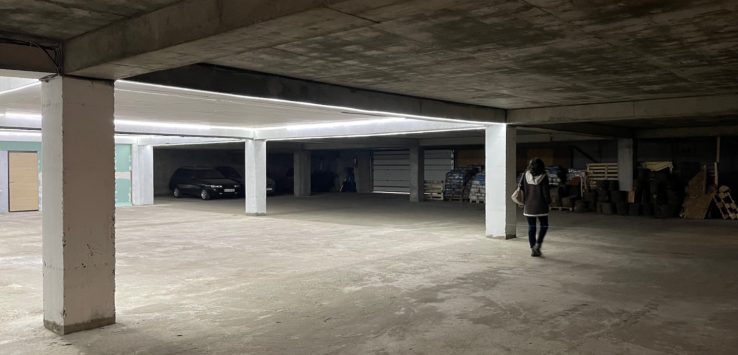 a person walking in a parking garage