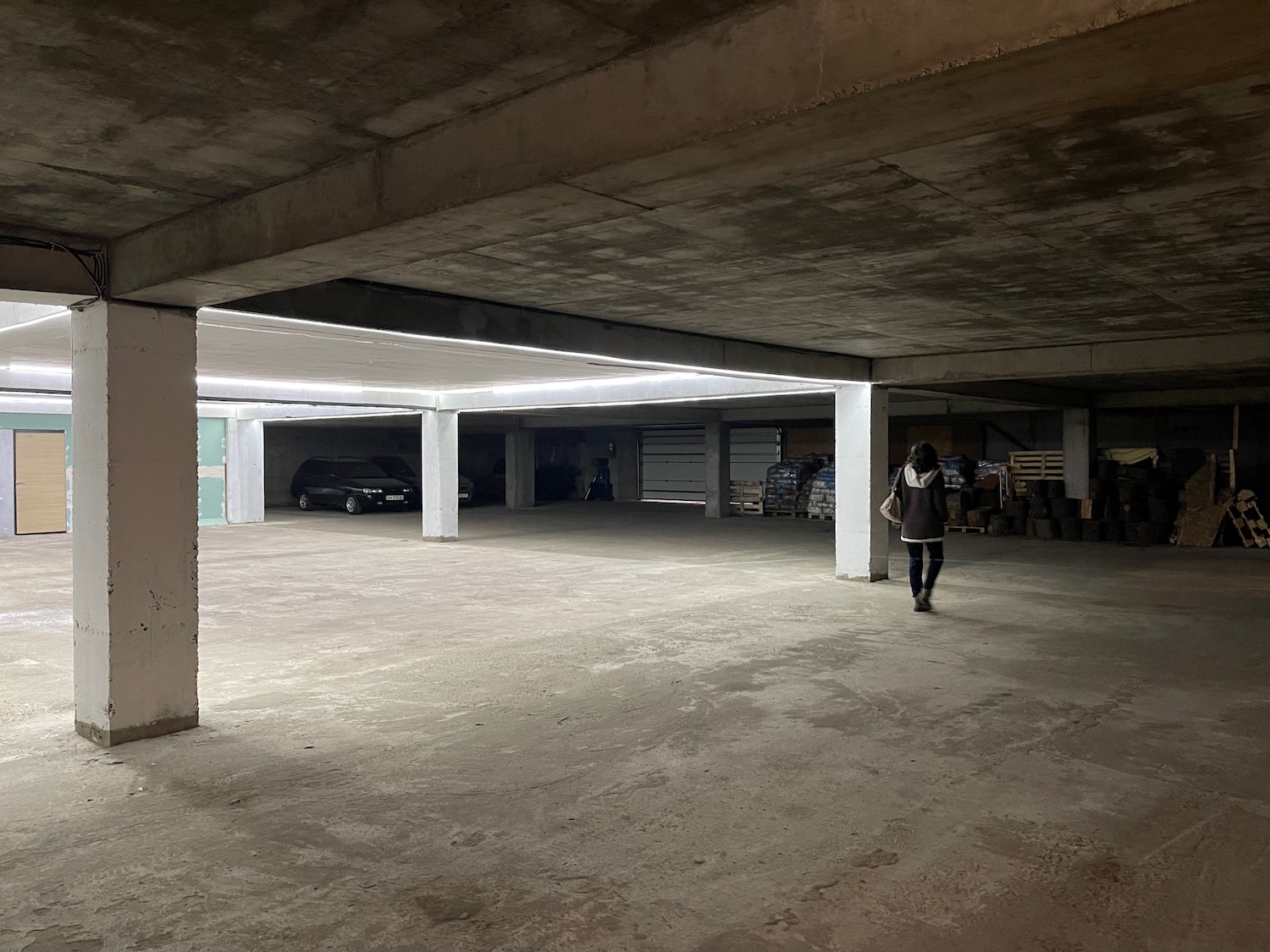 a person walking in a parking garage