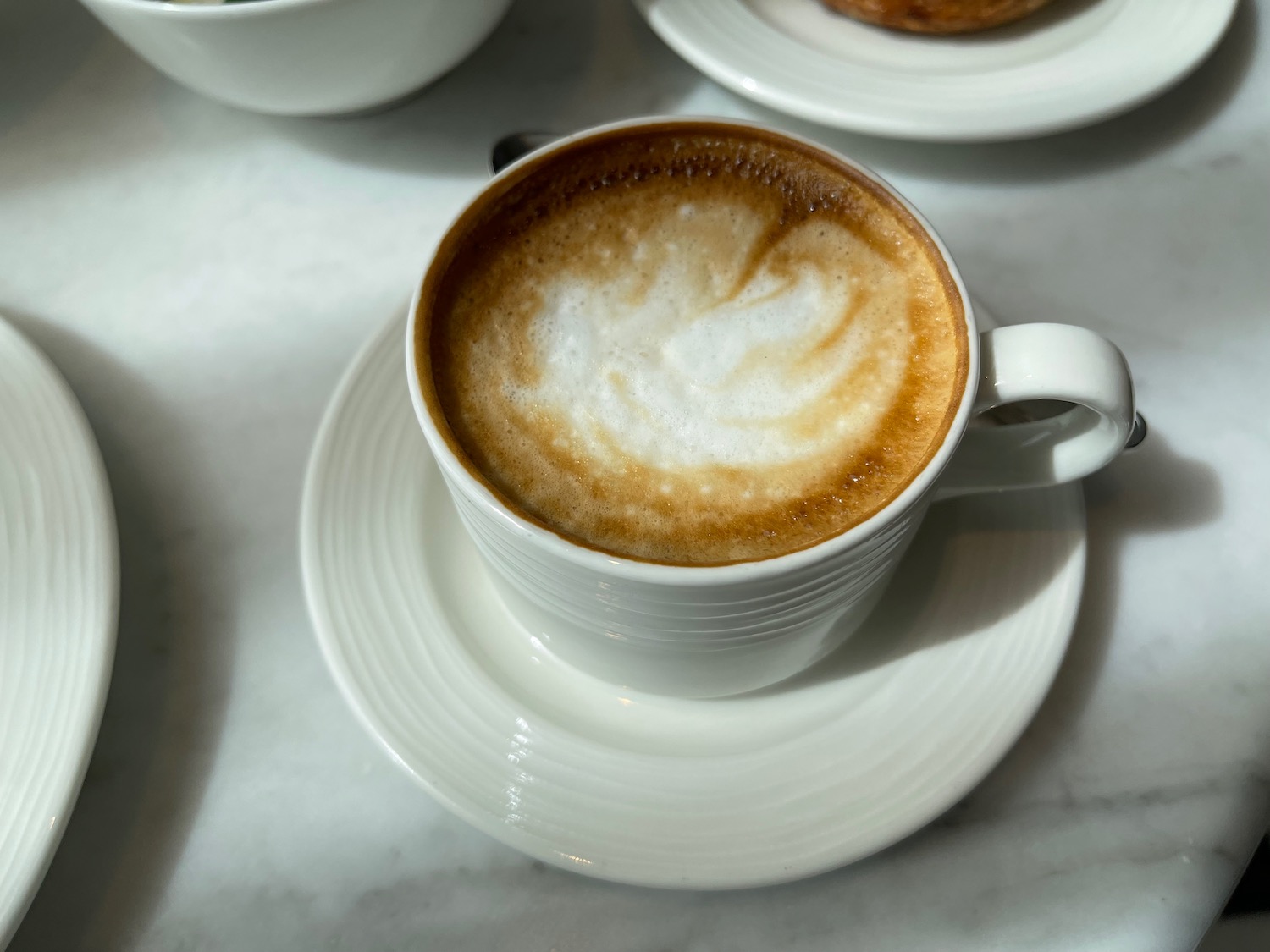 a cup of coffee with foam in it