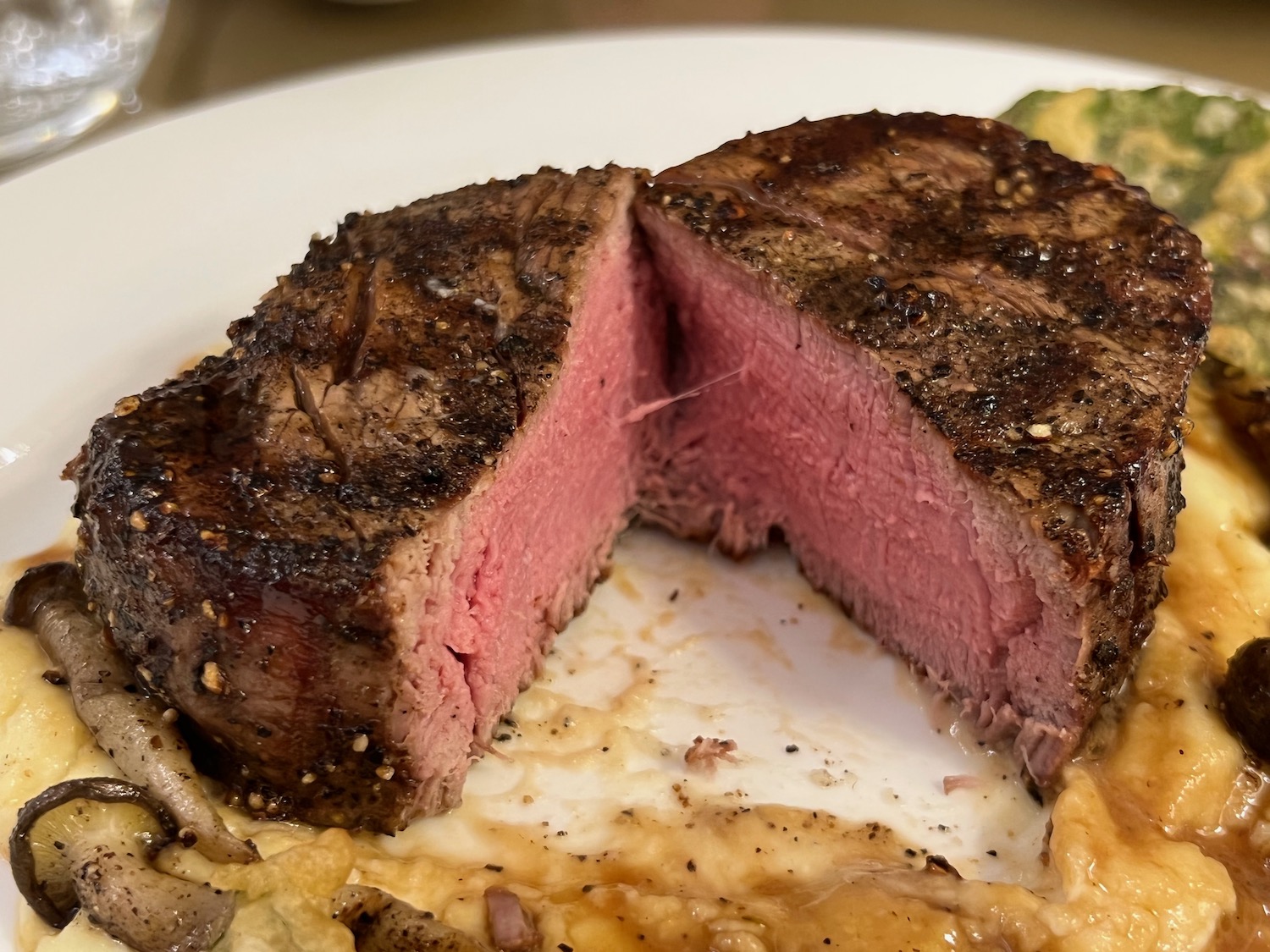 a steak cut in half on a plate