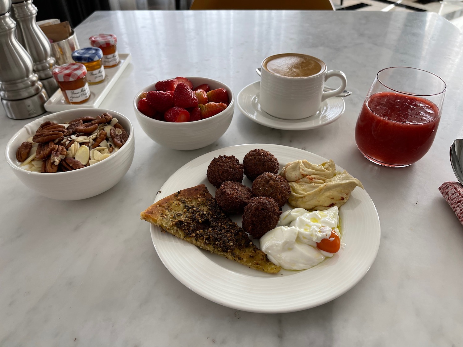 a plate of food and cups of coffee