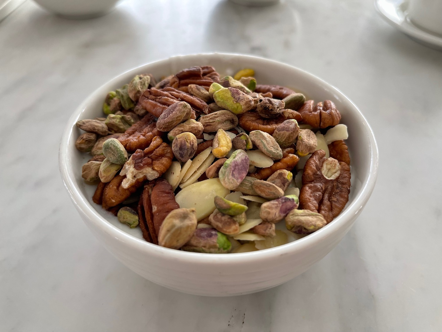a bowl of nuts and seeds