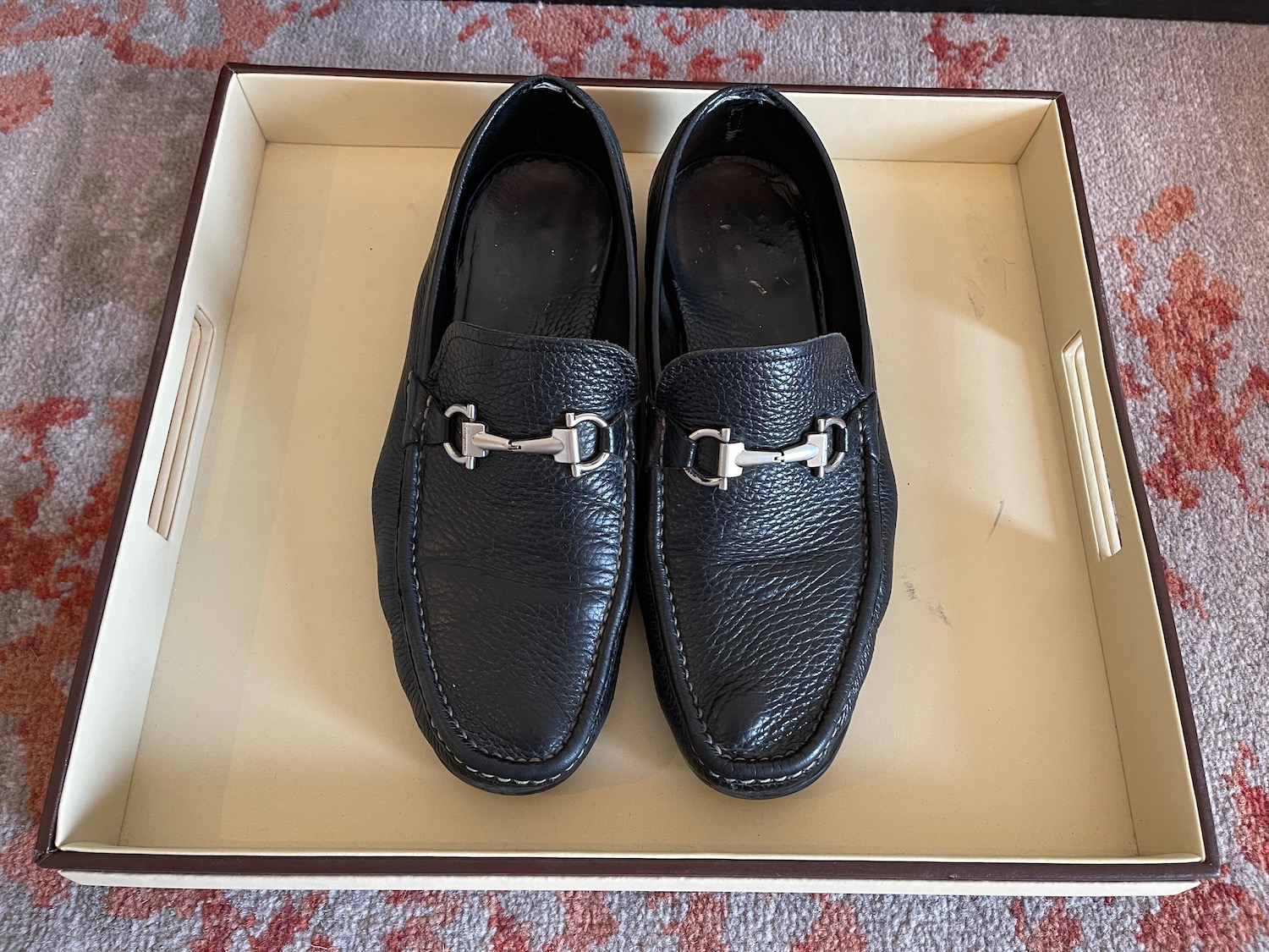 a pair of black shoes in a box
