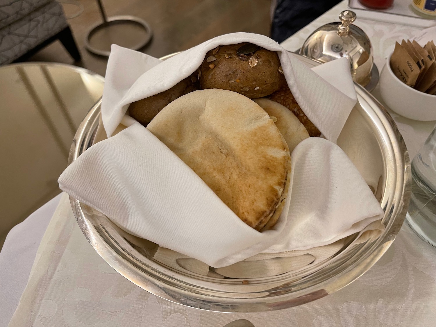 a plate of bread and rolls