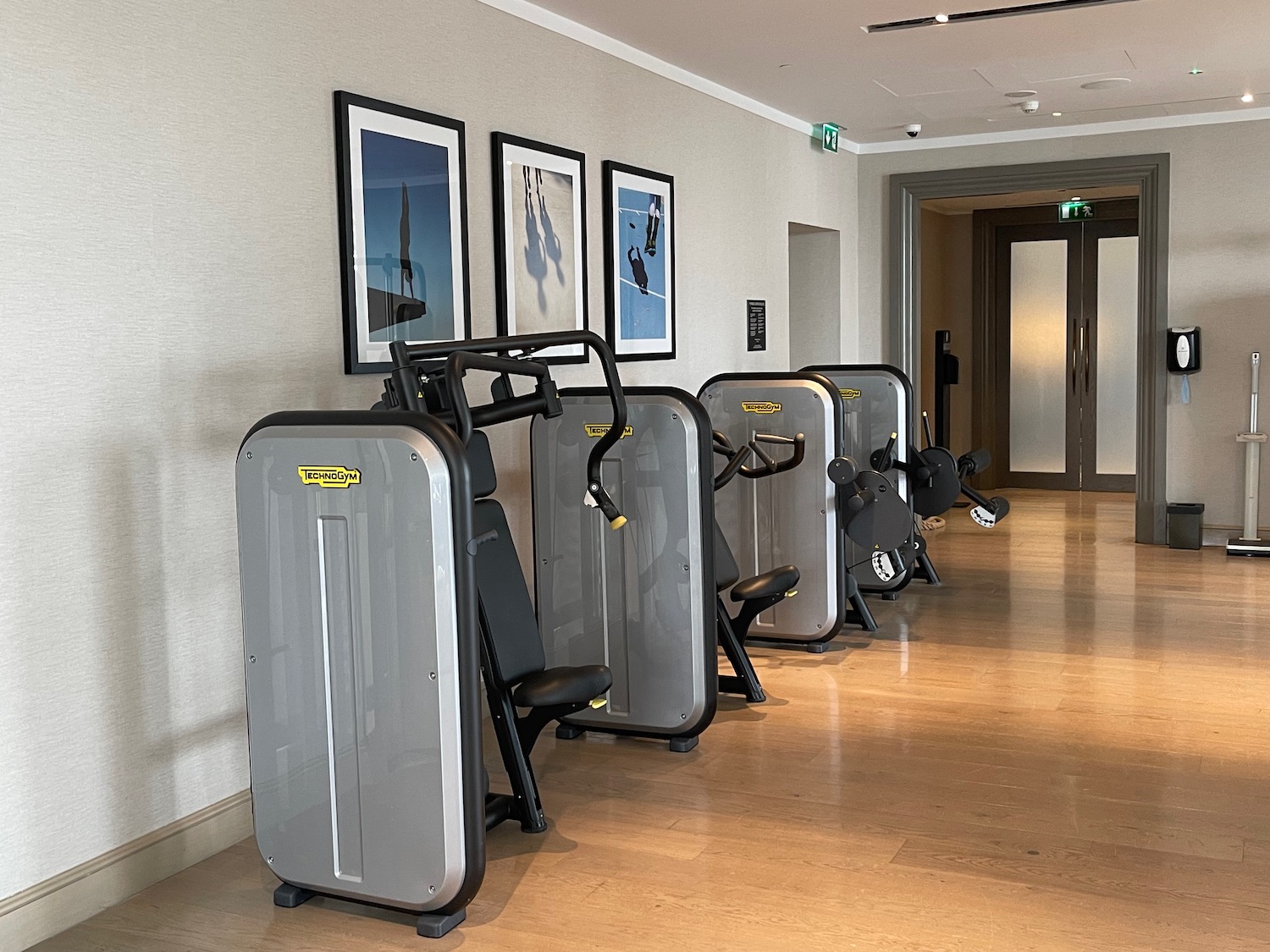 a row of exercise machines in a room