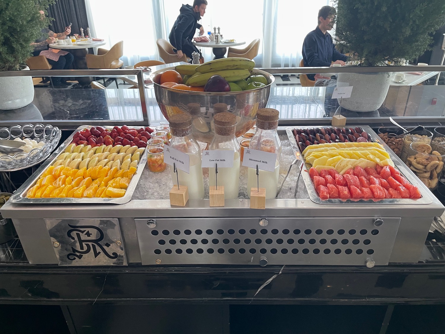 a buffet with fruit and drinks