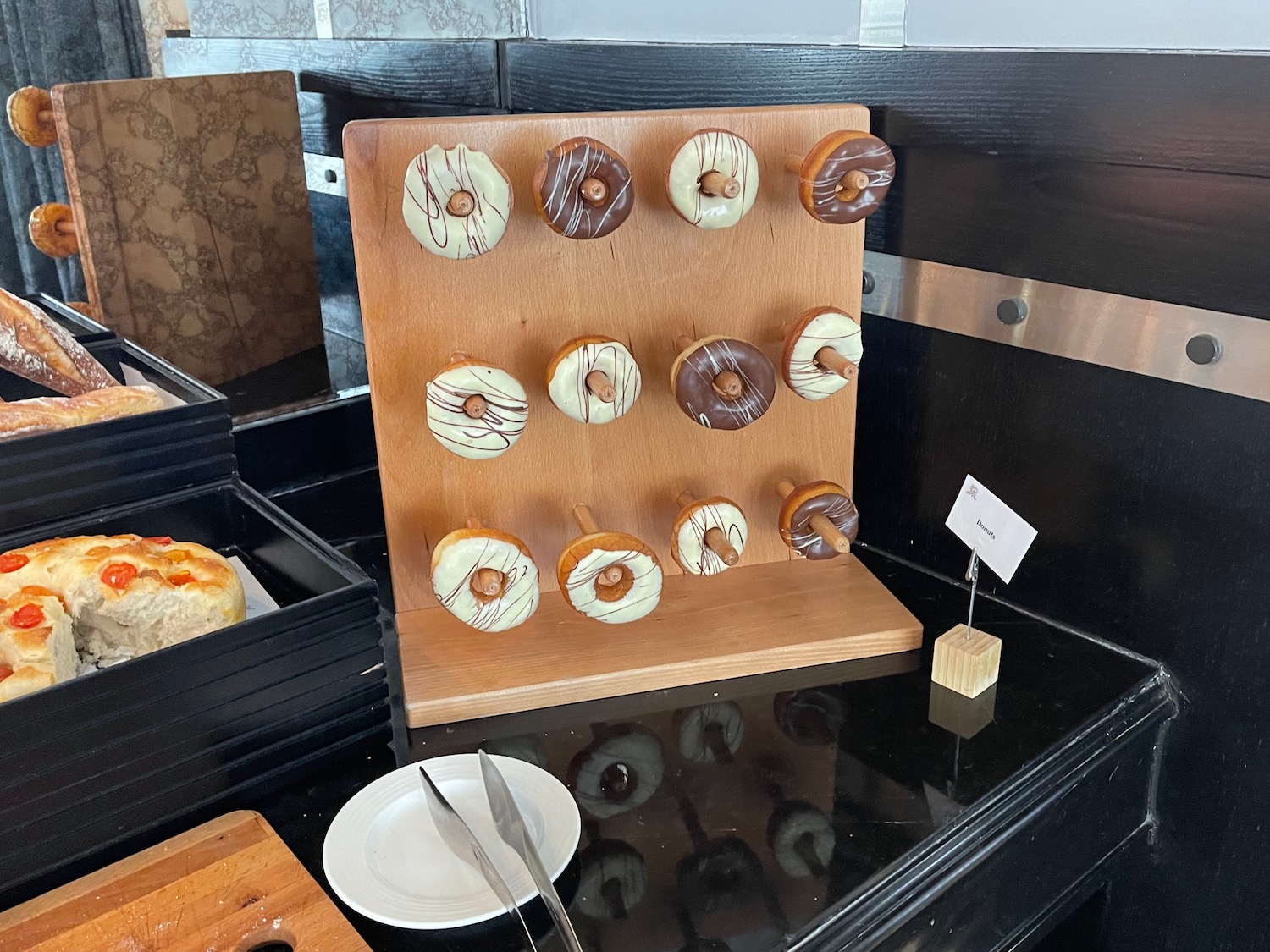 a wooden rack with donuts on it