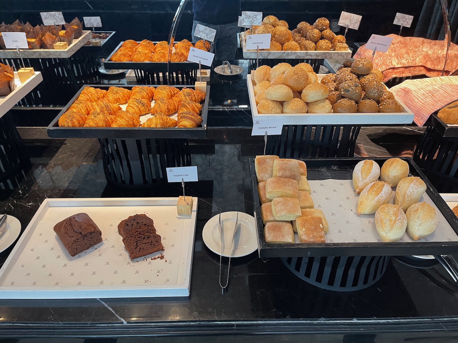 a trays of pastries and bread on a table