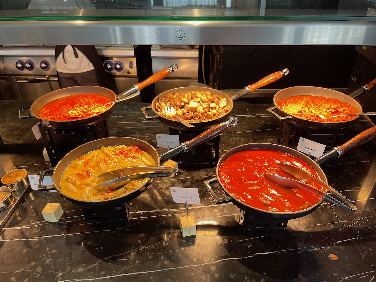 a group of pans with food in them