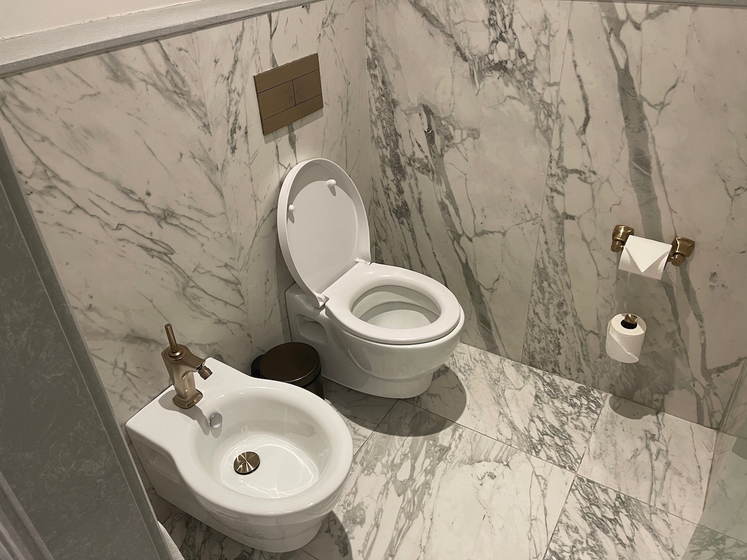 a toilet and bidet in a bathroom