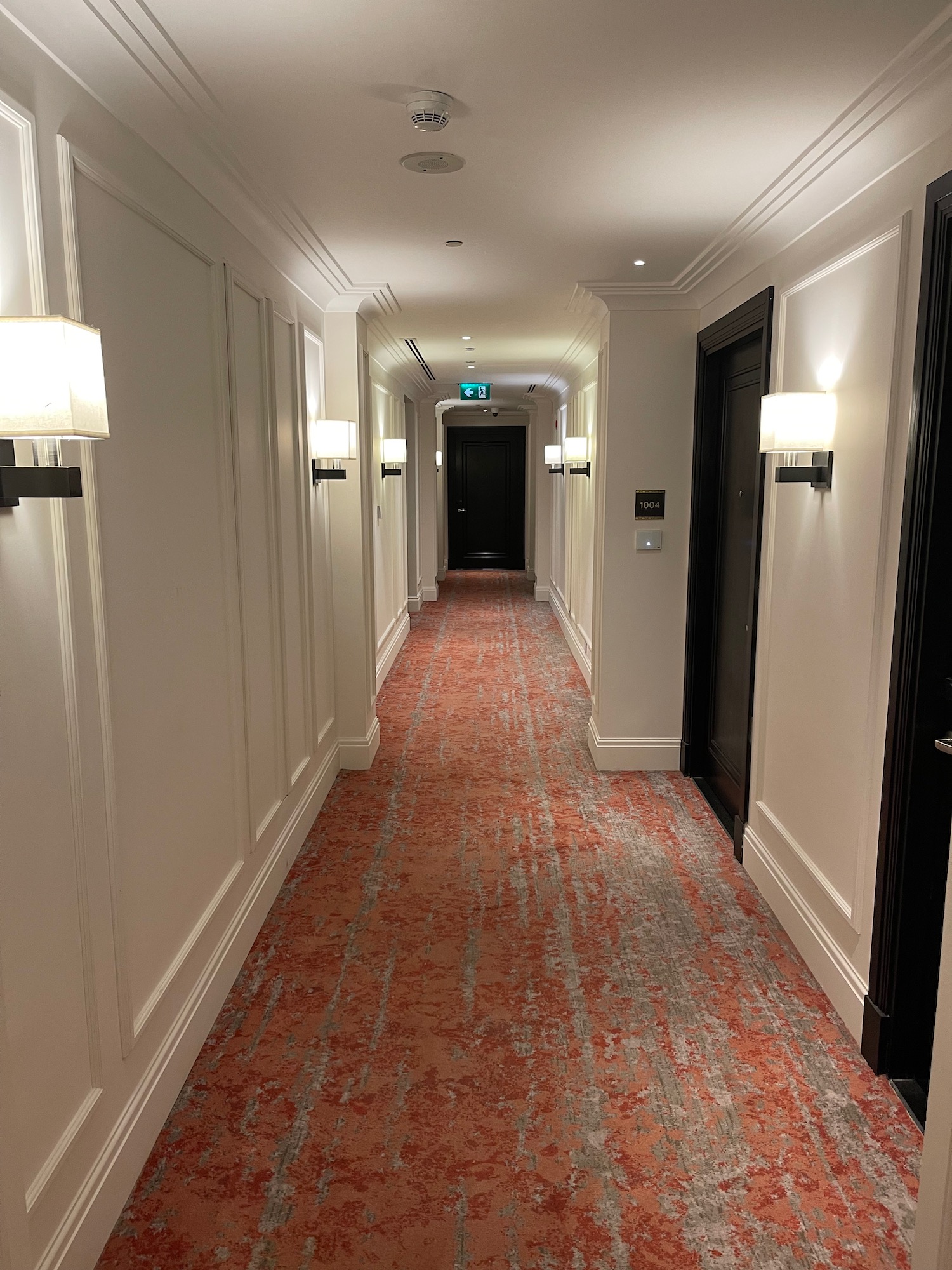 a hallway with doors and lights