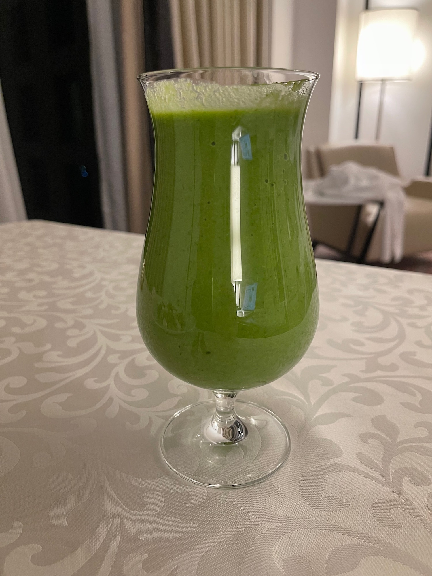 a glass of green liquid