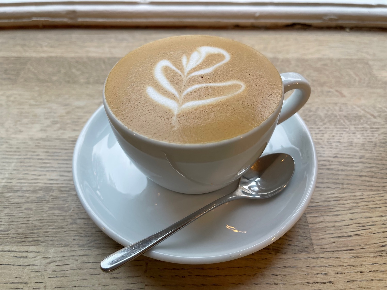 a cup of coffee with a spoon