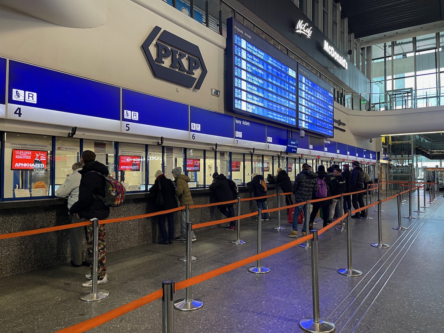 people standing in line at a counter