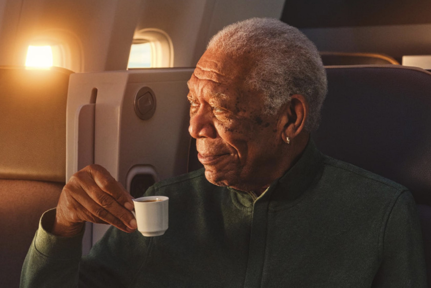 a man holding a cup of coffee