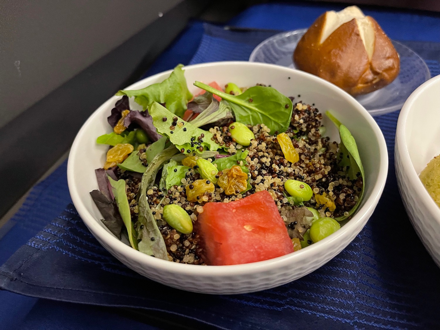 a bowl of salad with watermelon and fruit