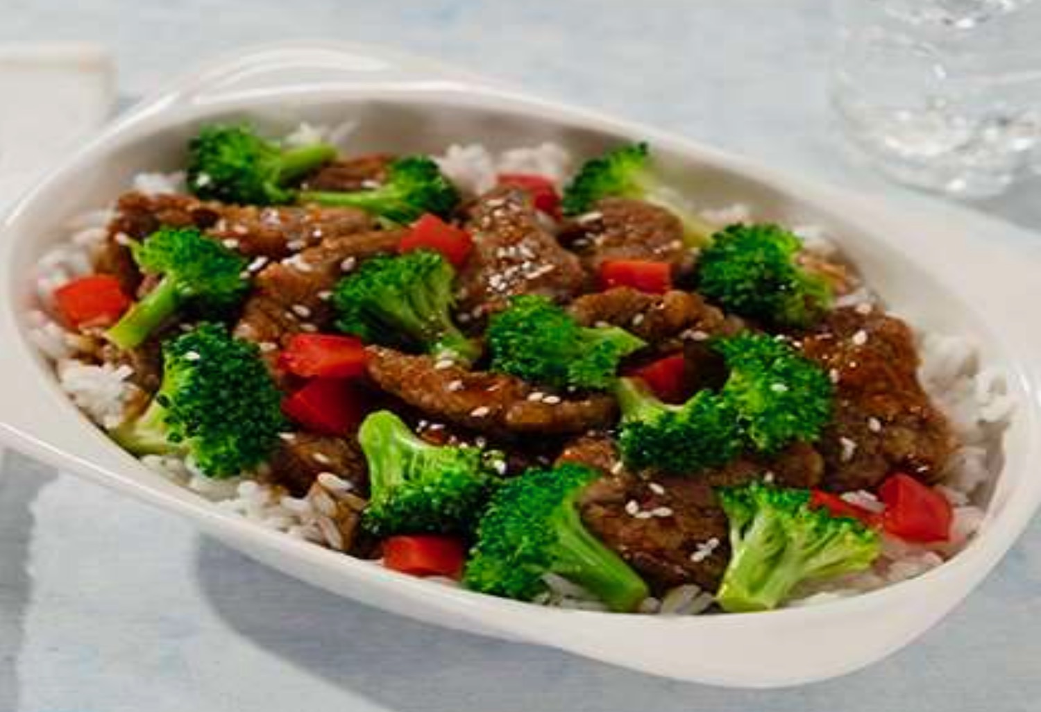 a plate of food with meat and broccoli