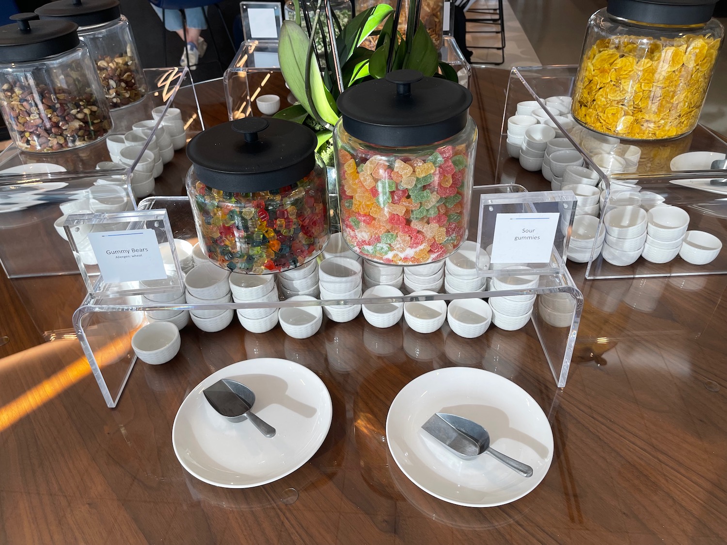 a group of candy in containers on a table