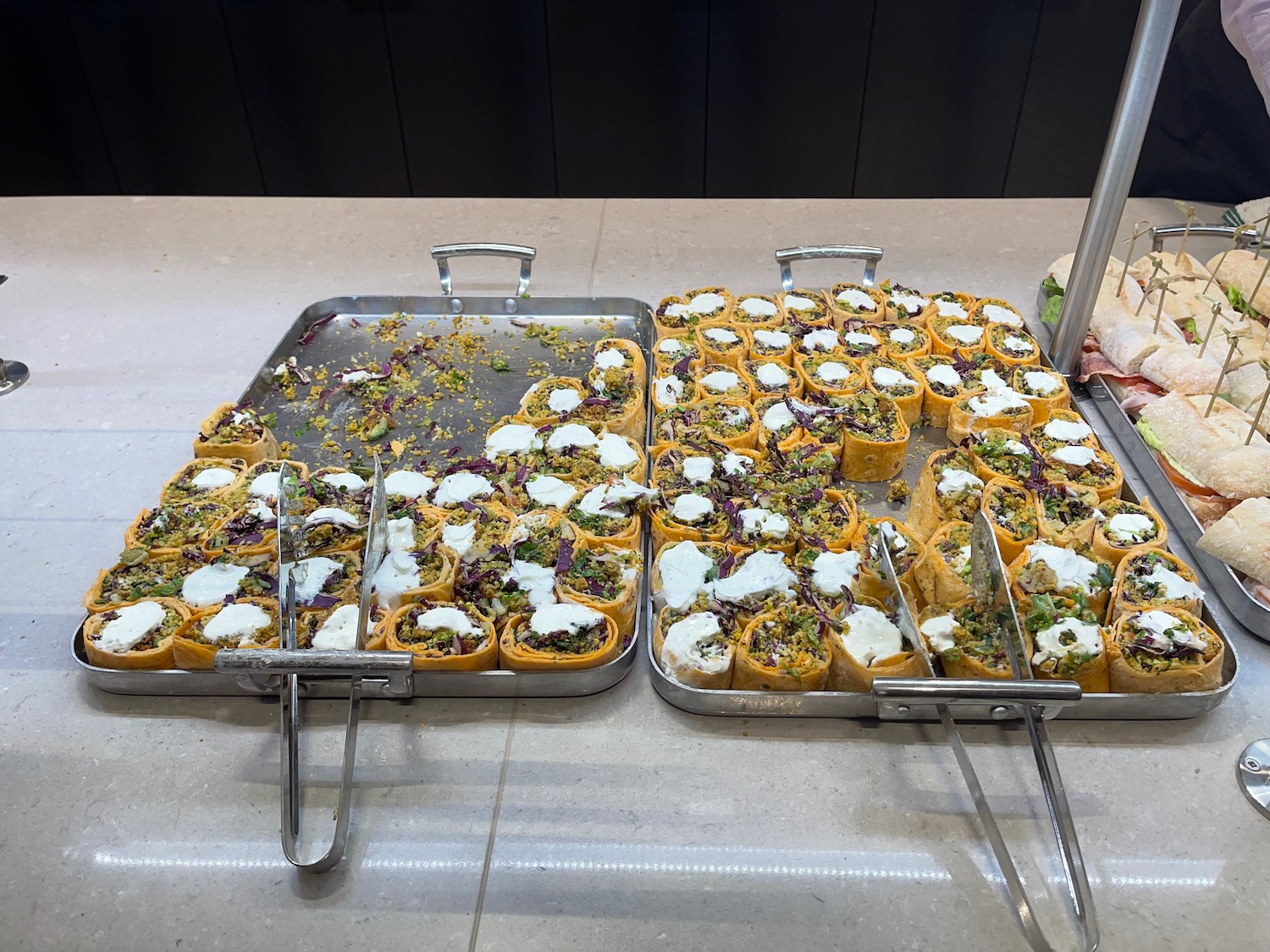 a trays of food on a counter