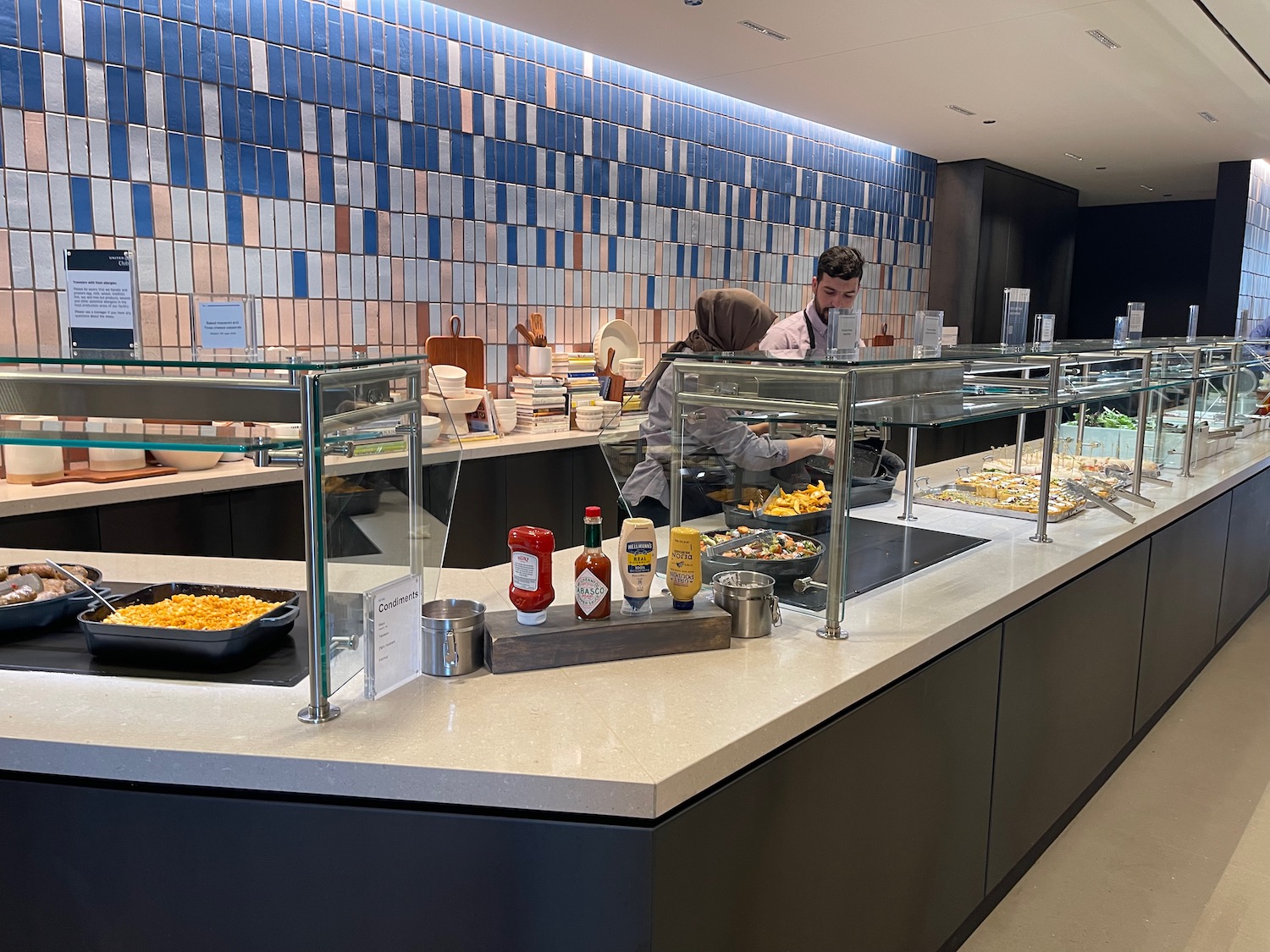 a man sitting at a counter in a restaurant