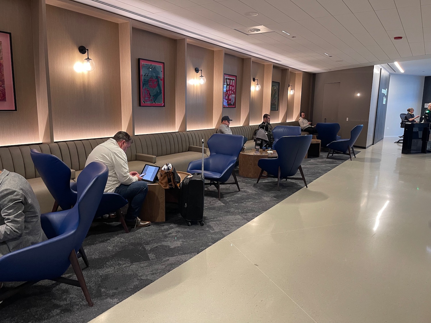 a group of people sitting in a waiting room