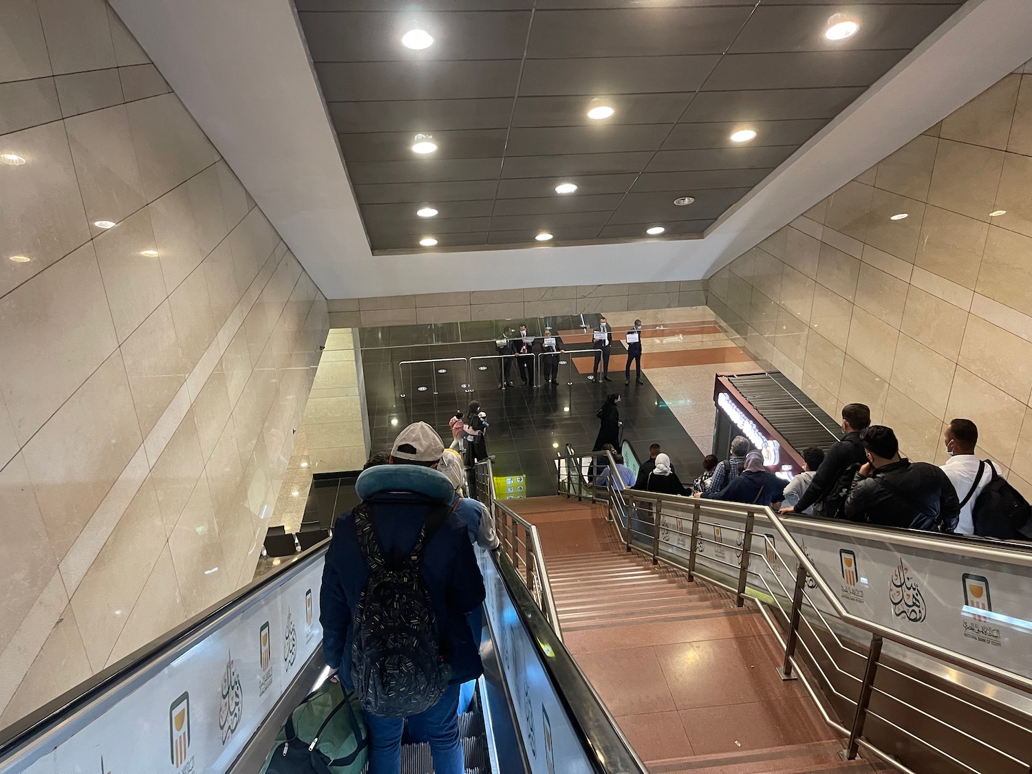 a group of people on escalators