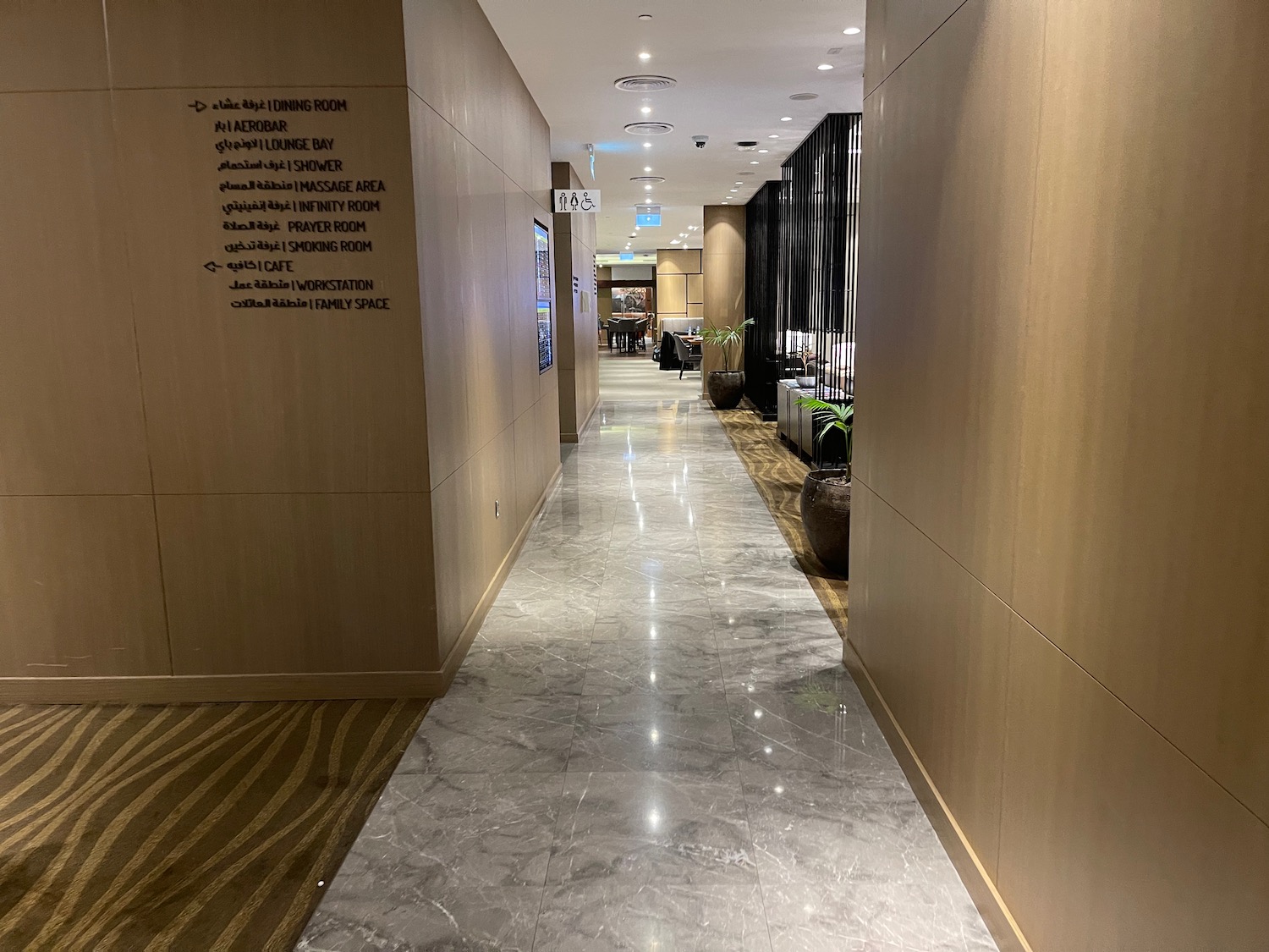 a hallway with a marble floor and a tile floor