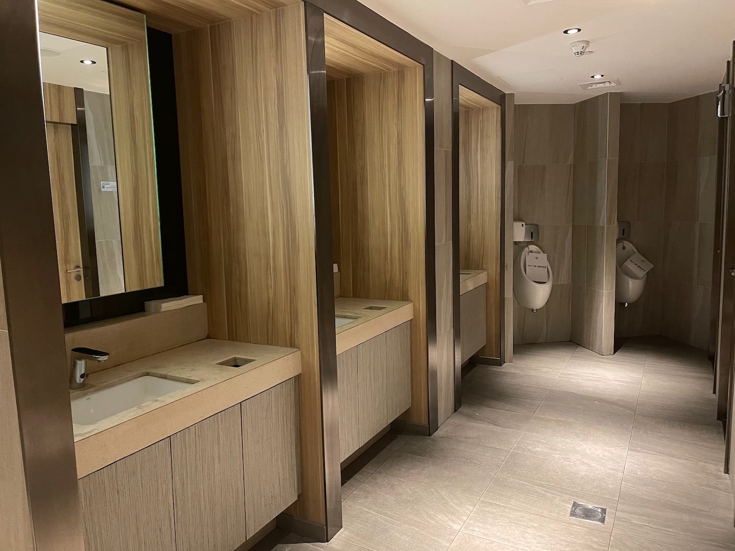 a bathroom with sinks and urinals