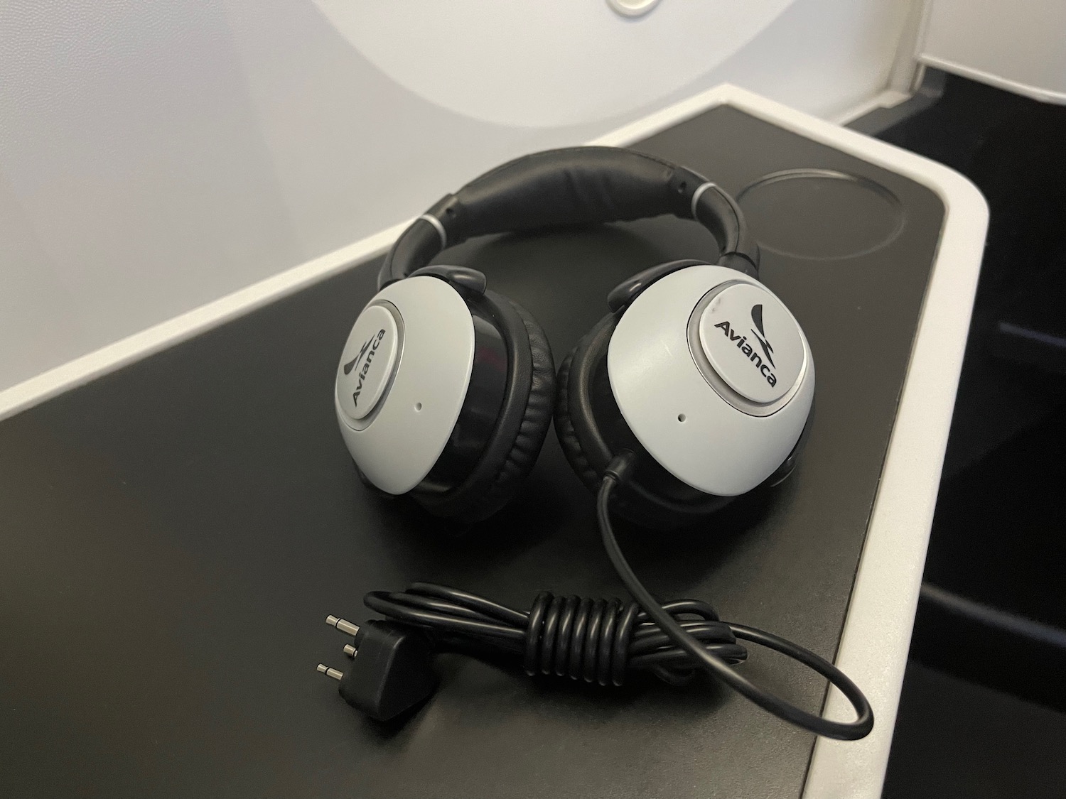 a pair of headphones on a black surface