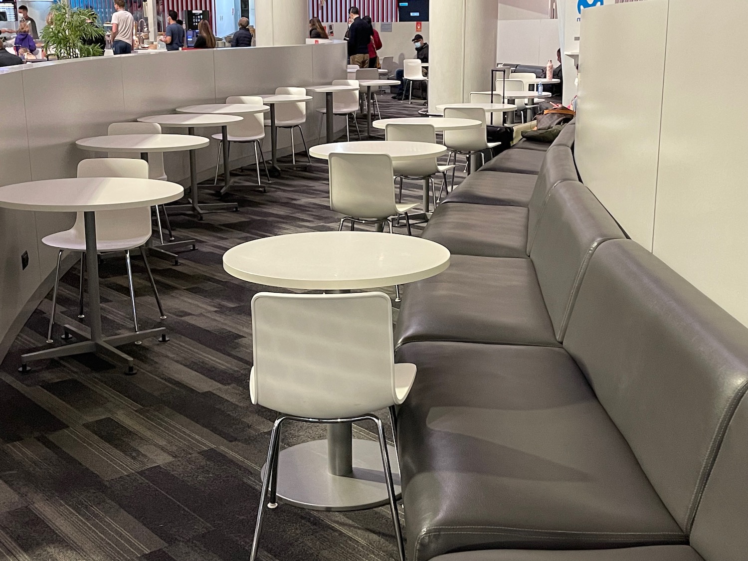 a group of tables and chairs in a cafeteria