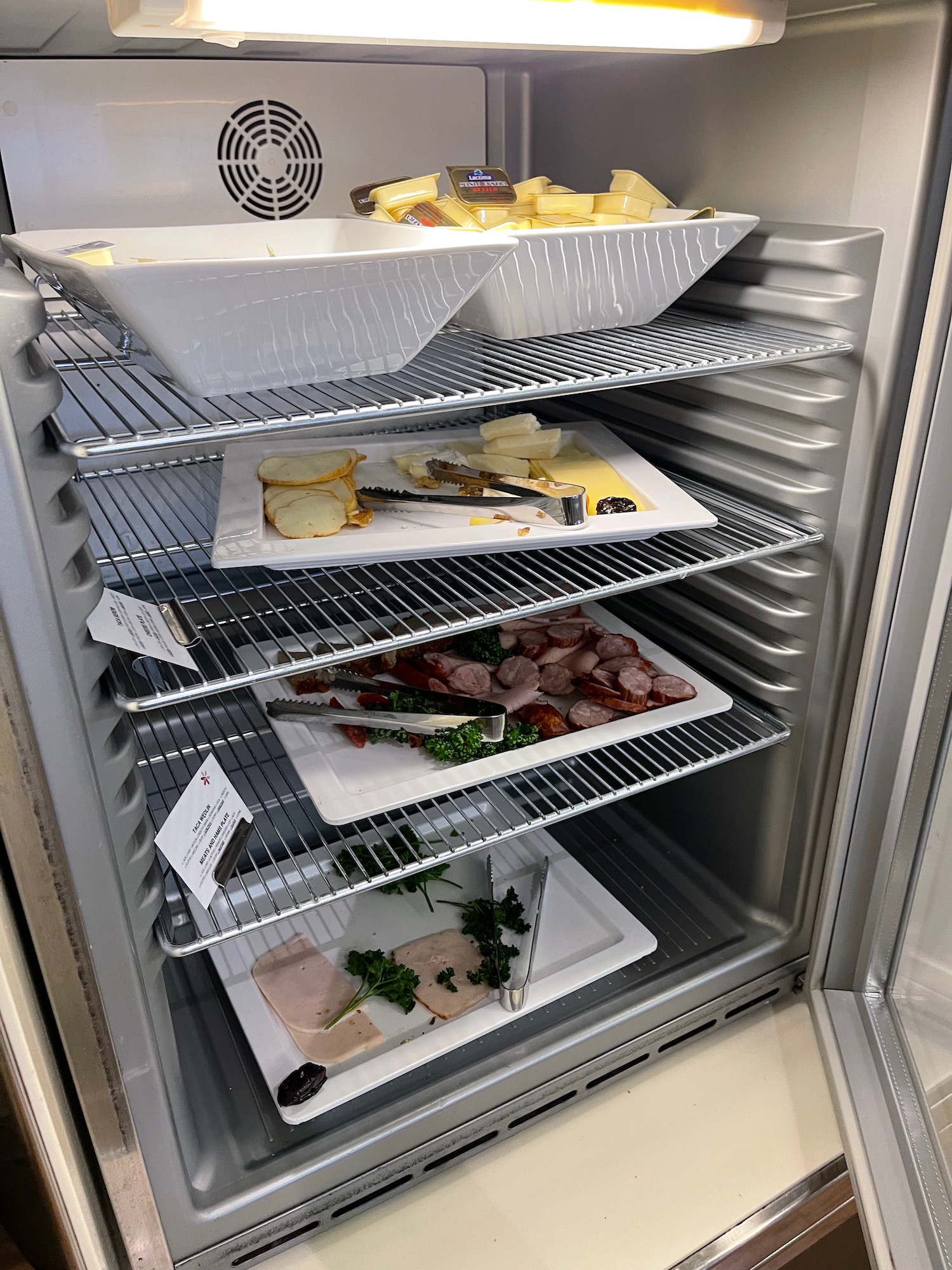 a refrigerator with food on shelves