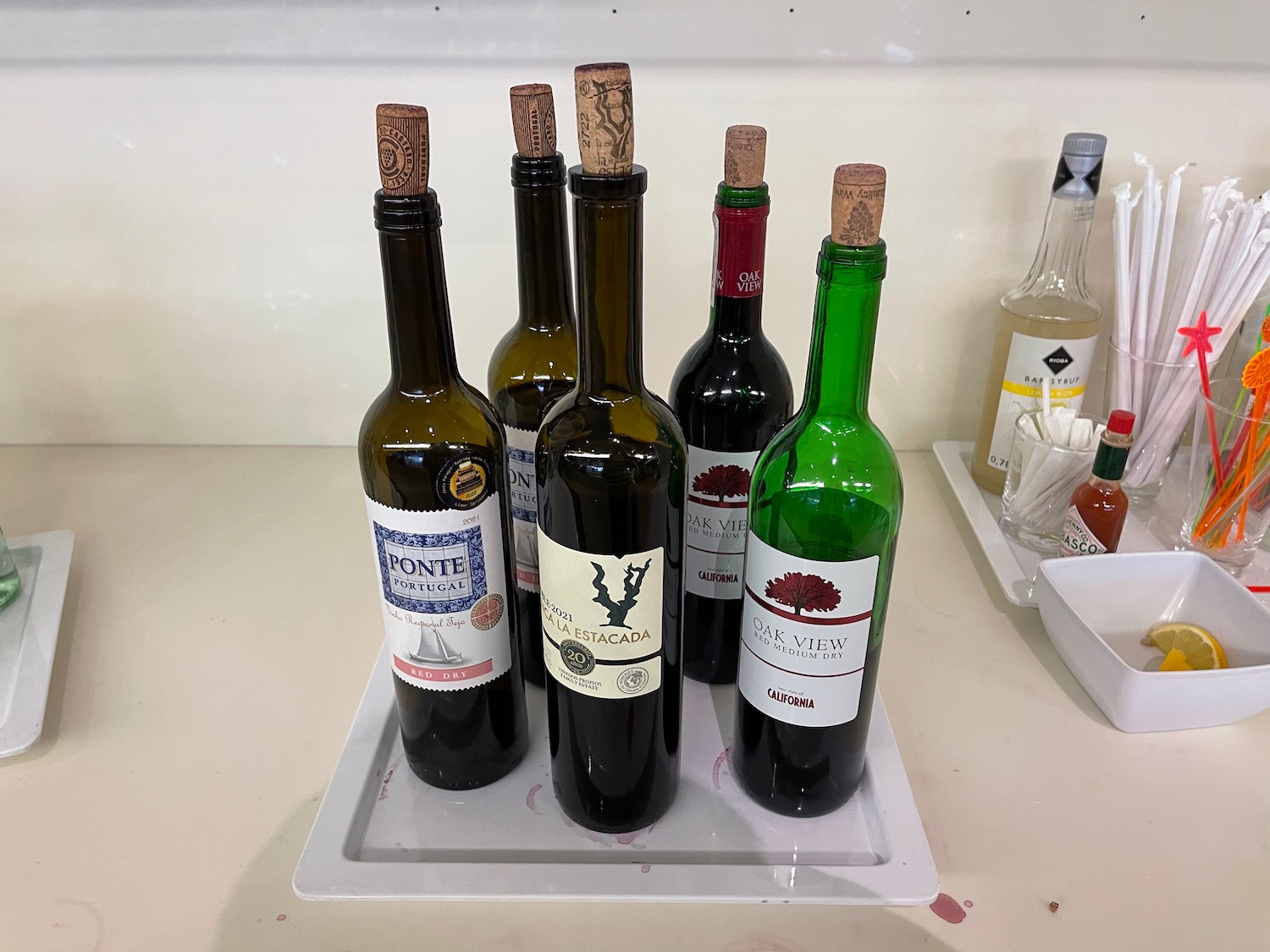 a group of wine bottles on a tray