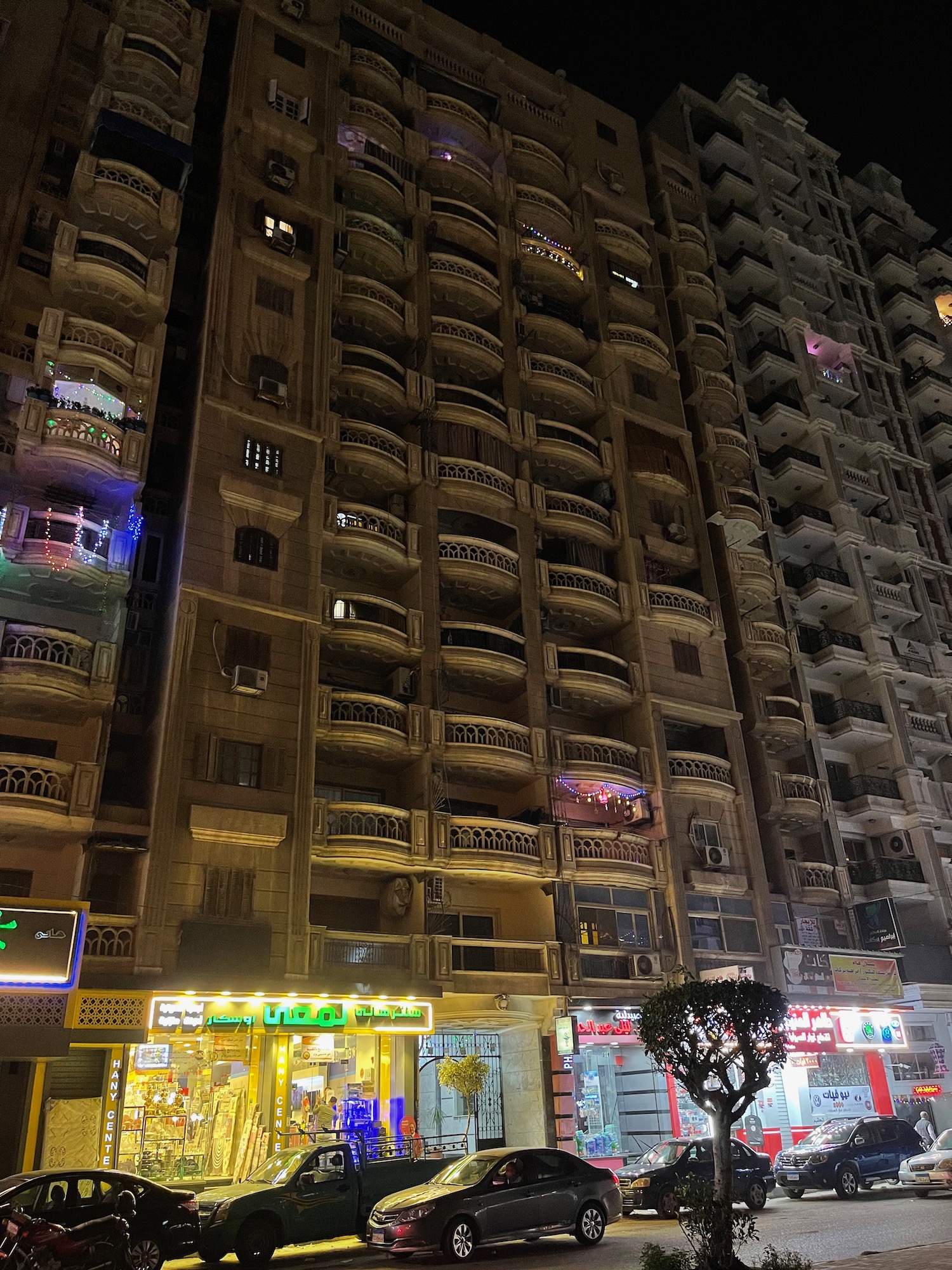 a building with many balconies at night
