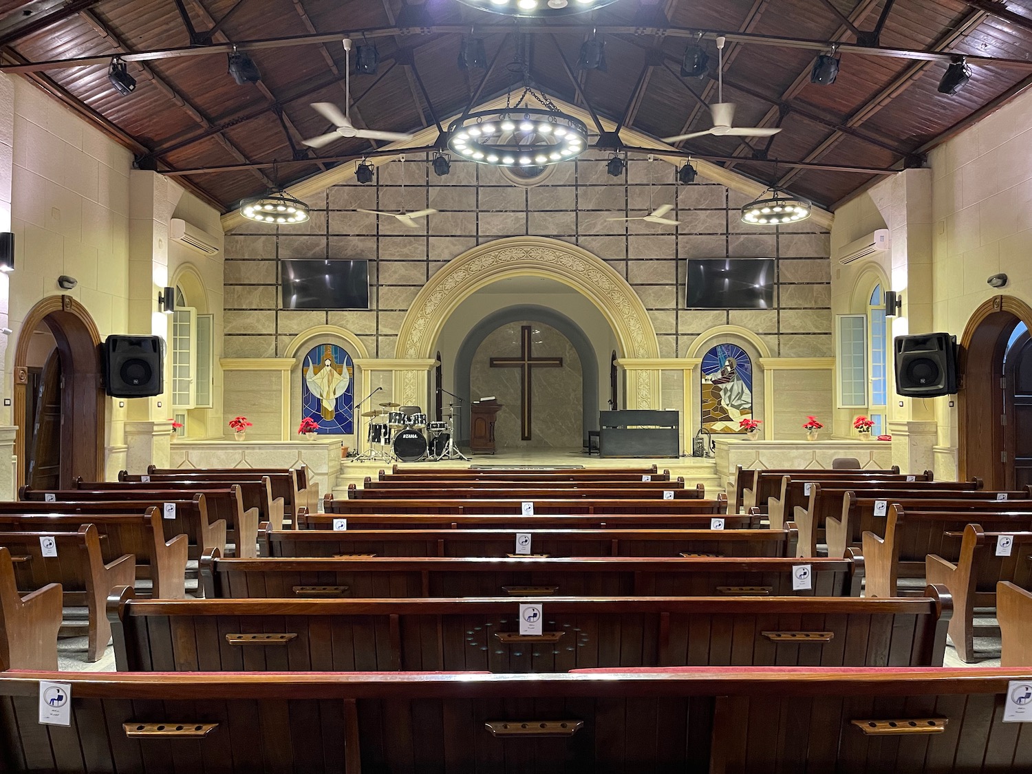 a church with wooden benches and a stage