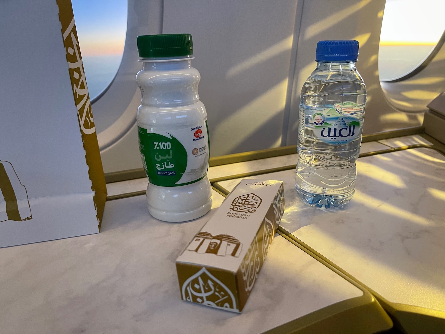 a bottle of milk and a box on a table