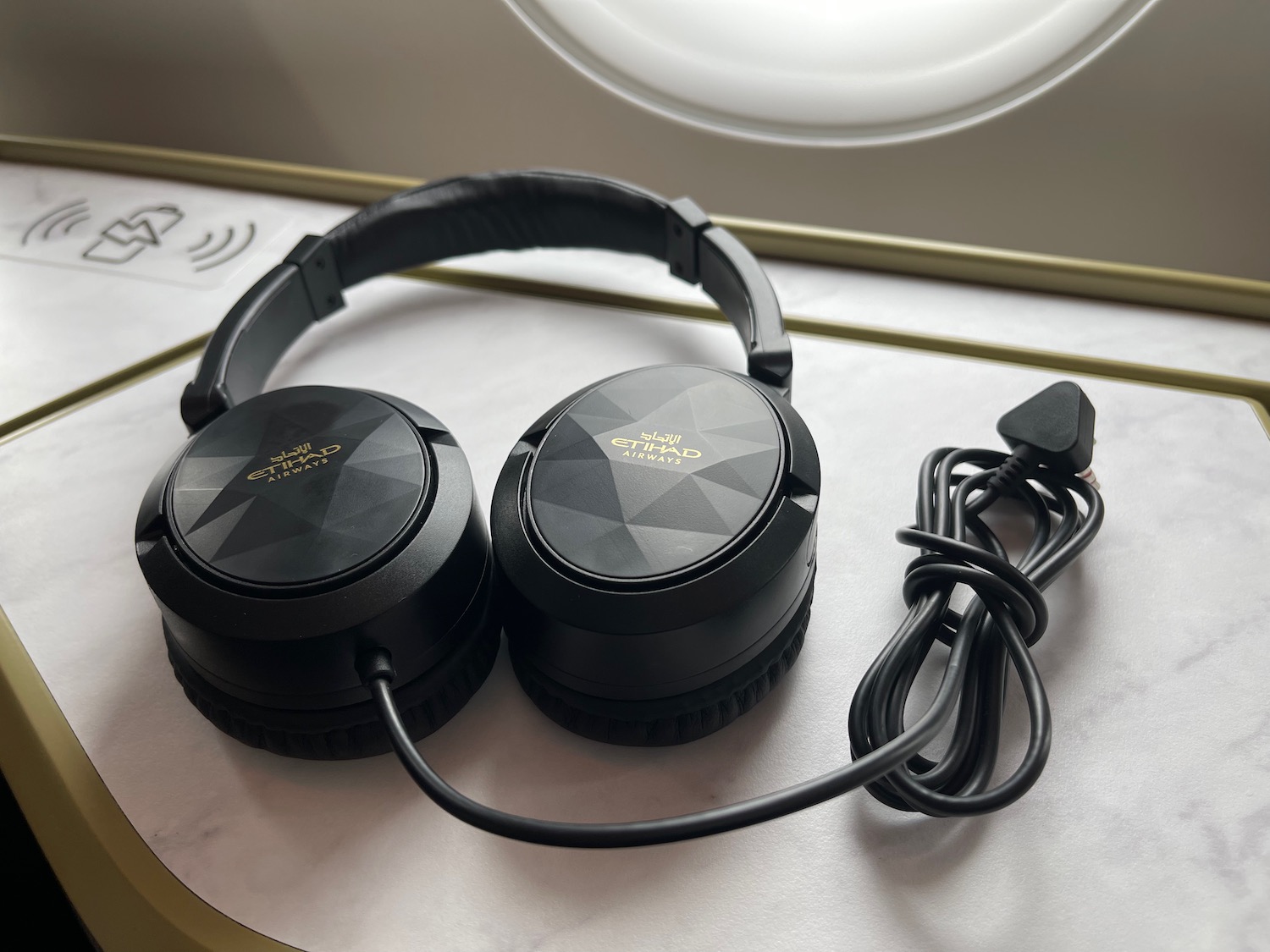 a pair of black headphones on a table