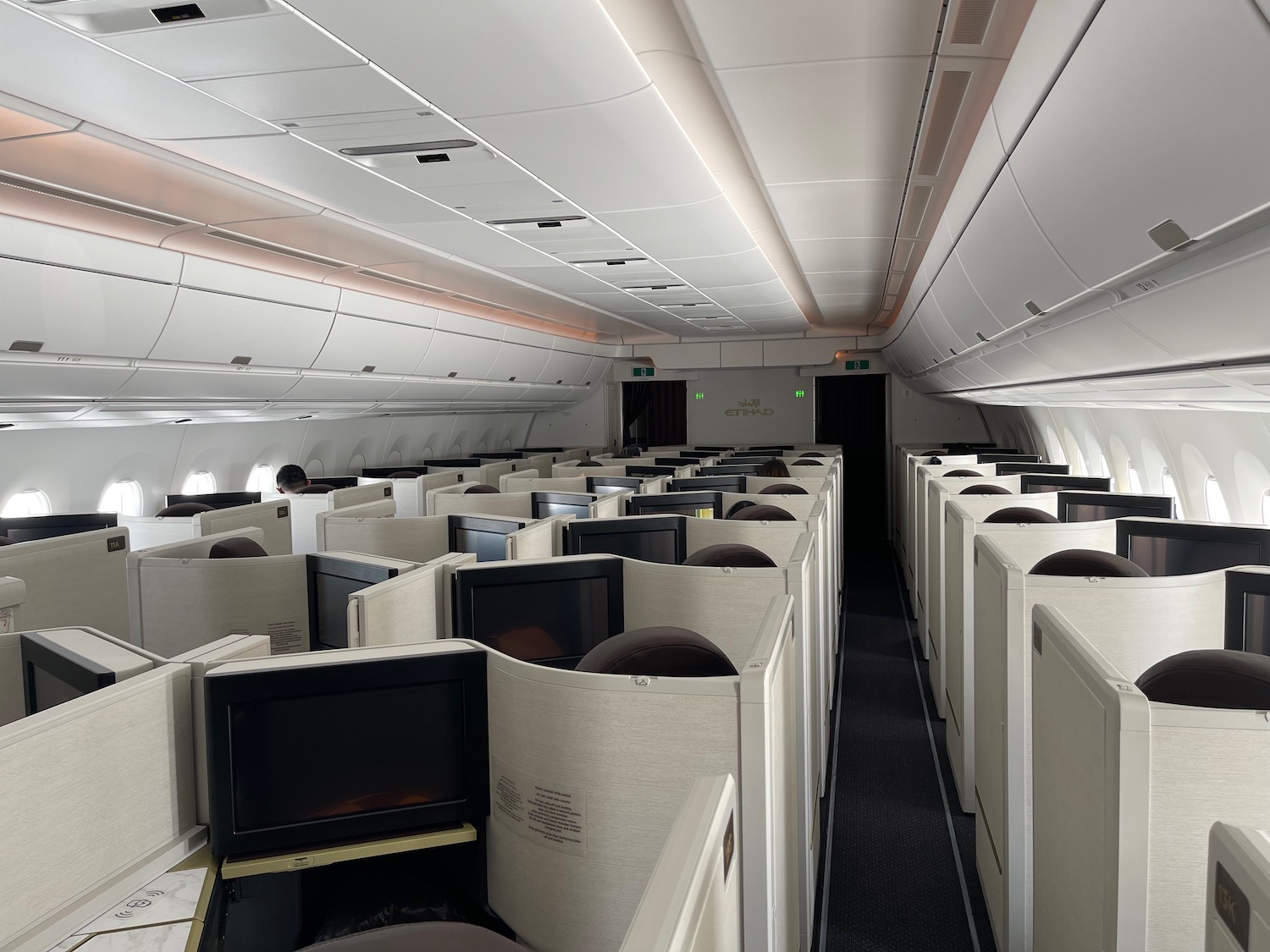 a row of white cubicles in an airplane